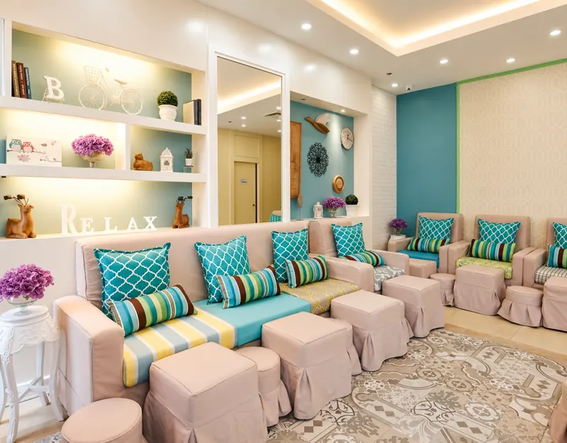 Pedicure lounge with teal cushions