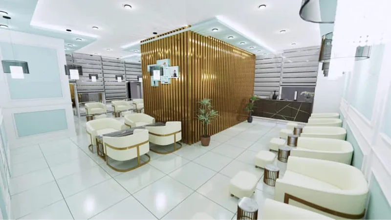 Design render of a Nailandia studio with cream chairs, a gold slatted wall and a marble counter